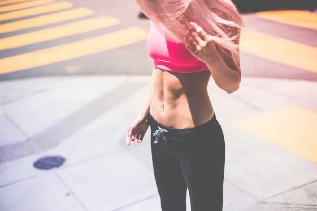 Woman with toned stomach after LA-EMS Body Sculpting Treatment Richmond 